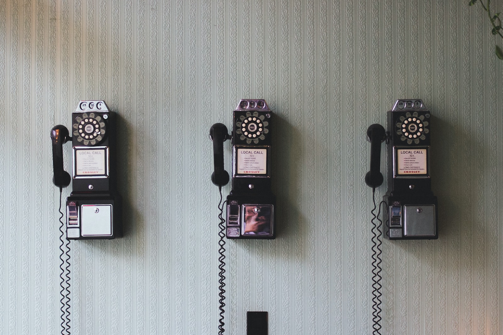 minimalist photography of three crank phones, symbolizing how westwing insurances's 1,2,3 method for auto insurance in California works. 