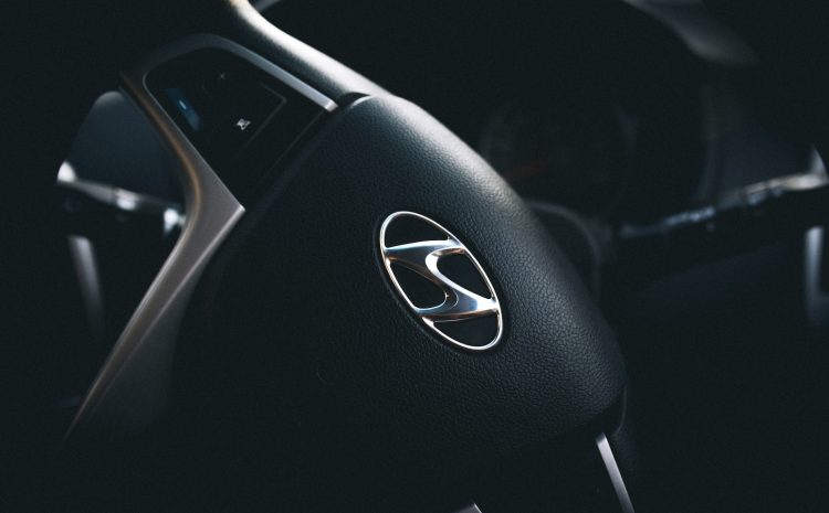 selective focus of black Hyundai steering wheel