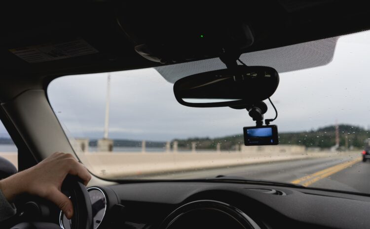 a person driving a car on a highway