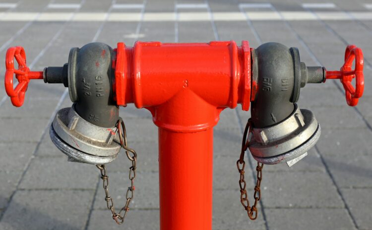 red and silver steel pipe